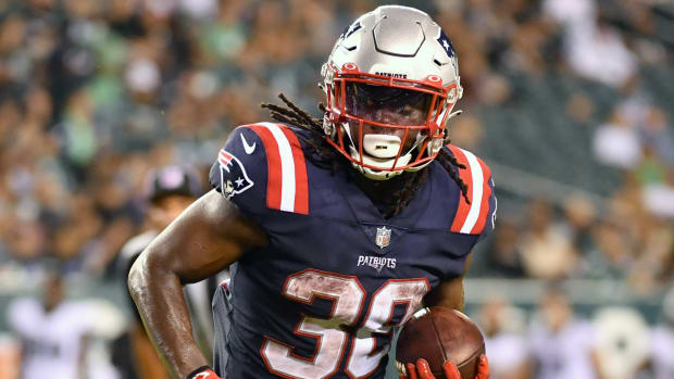 Rhamondre Stevenson goes to the Patriots in SI's re-draft of the 2021 NFL draft.